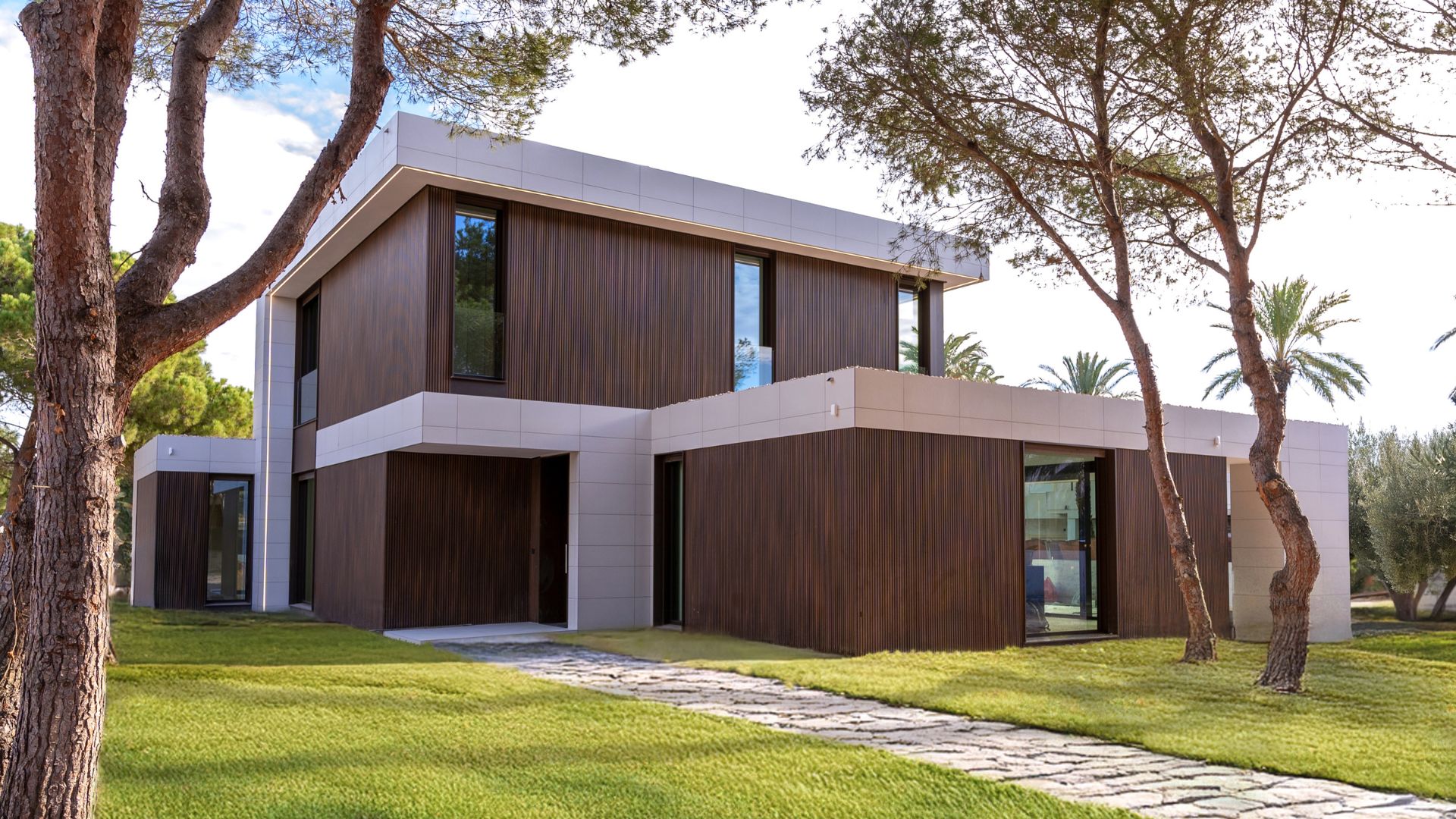 Luxury modular house façade with laminated technological wood and led light